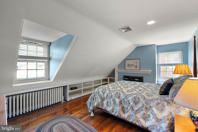 55 The Strand, New Castle, DE 19720 - bedroom featuring radiator, hardwood / wood-style floors, multiple windows, lofted ceiling, and recessed lighting