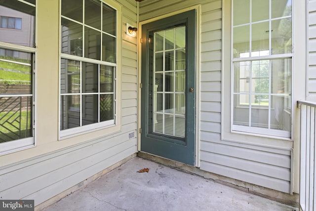 doorway to property with a porch