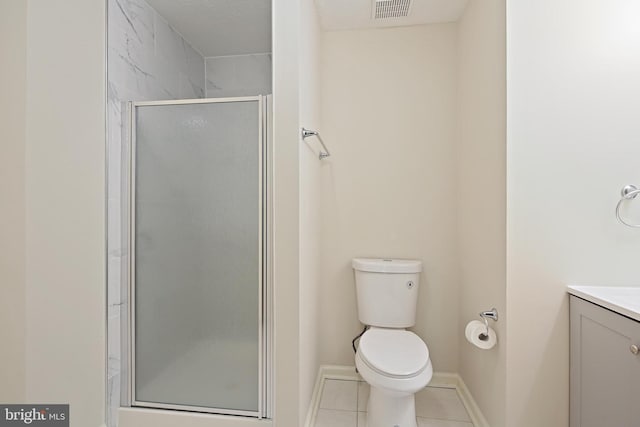 full bath with a stall shower, tile patterned floors, vanity, toilet, and baseboards