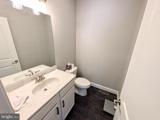 130 Corktree Rd, Kunkletown, PA 18058 - bathroom featuring toilet, vanity, wood finished floors, and baseboards