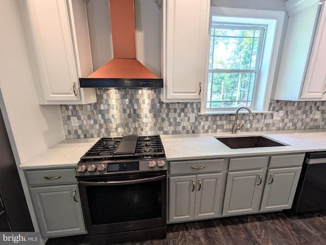 130 Corktree Rd, Kunkletown, PA 18058 - kitchen with stainless steel appliances, wall chimney range hood, a sink, gray cabinets, and tasteful backsplash