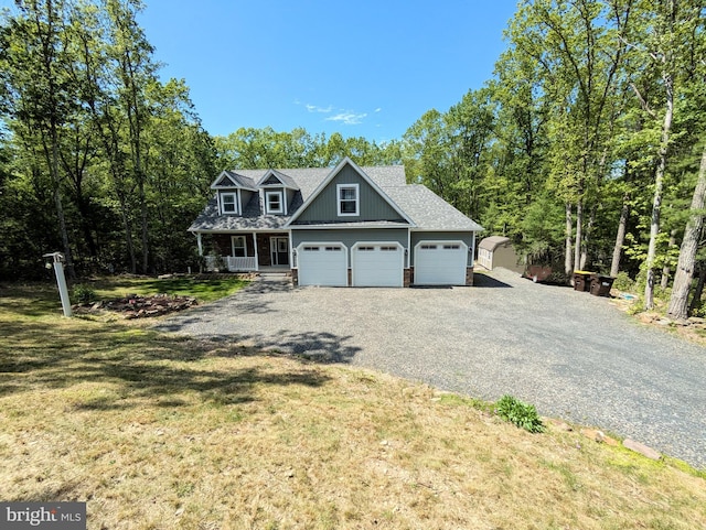 130 Corktree Rd, Kunkletown, PA 18058 - view of front of house with driveway, a front yard, an attached garage, a porch, and a shingled roof