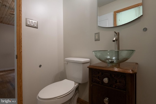 22 Meadow Creek Dr, Newport News, VA 23608 - half bath featuring wood finished floors, vanity, toilet, and baseboards
