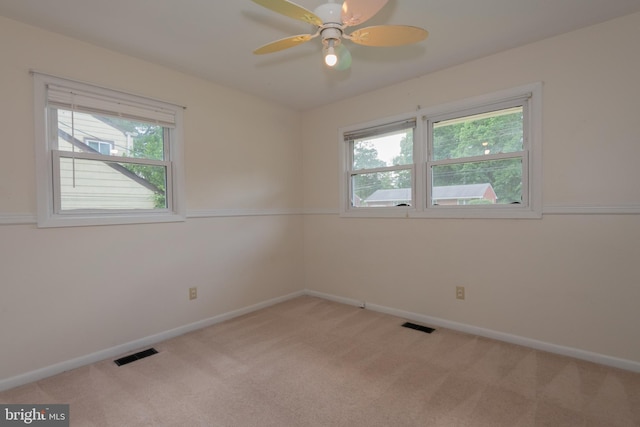 22 Meadow Creek Dr, Newport News, VA 23608 - empty room with healthy amount of natural light, light colored carpet, baseboards, and a ceiling fan