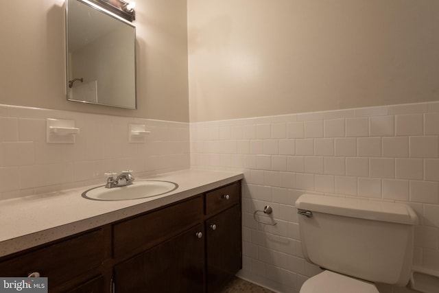22 Meadow Creek Dr, Newport News, VA 23608 - half bathroom featuring toilet, vanity, a wainscoted wall, and tile walls