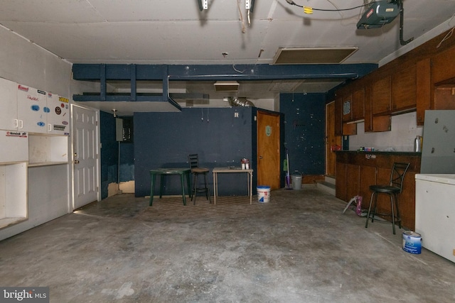 22 Meadow Creek Dr, Newport News, VA 23608 - garage featuring freestanding refrigerator, a garage door opener, and refrigerator