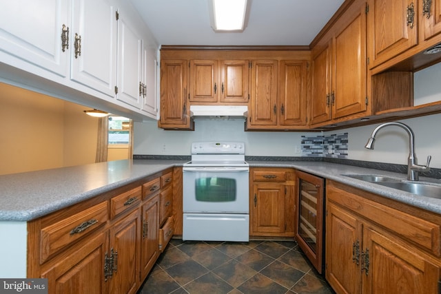 22 Meadow Creek Dr, Newport News, VA 23608 - kitchen with white range with electric cooktop, beverage cooler, a sink, under cabinet range hood, and brown cabinets