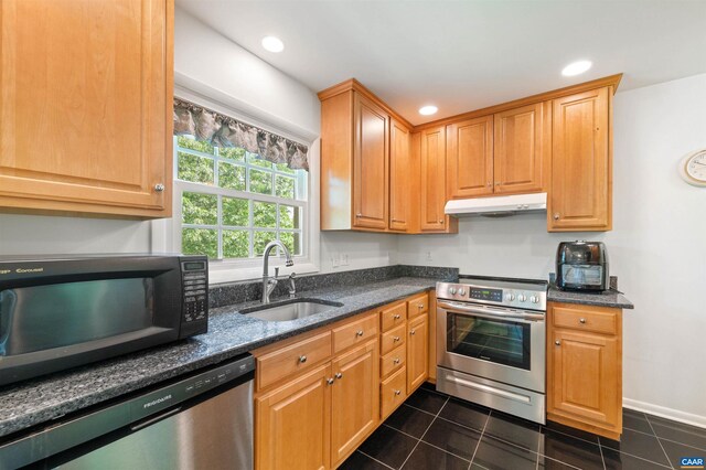 150 N Bennington Rd, Charlottesville, VA 22901 - kitchen featuring stainless steel appliances, a sink, under cabinet range hood, dark tile patterned flooring, and dark stone counters