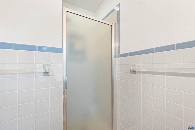 150 N Bennington Rd, Charlottesville, VA 22901 - bathroom with a shower stall and tile walls