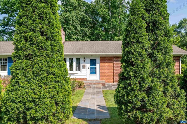 150 N Bennington Rd, Charlottesville, VA 22901 - view of front facade featuring brick siding, a chimney, and a shingled roof