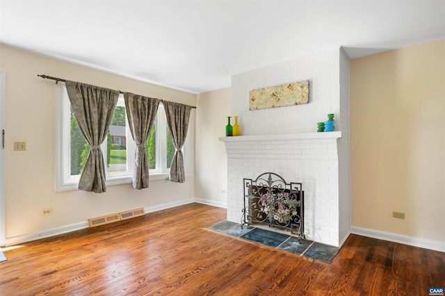150 N Bennington Rd, Charlottesville, VA 22901 - unfurnished living room with wood finished floors, baseboards, and a fireplace