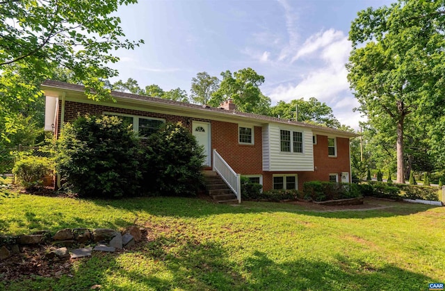 150 N Bennington Rd, Charlottesville, VA 22901 - view of front of home with brick siding, a front lawn, and a chimney