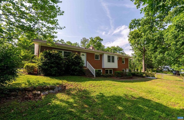 150 N Bennington Rd, Charlottesville, VA 22901 - rear view of house with a lawn and brick siding