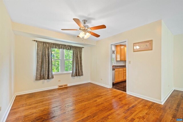 150 N Bennington Rd, Charlottesville, VA 22901 - empty room with ceiling fan, dark wood-style floors, baseboards, and a sink