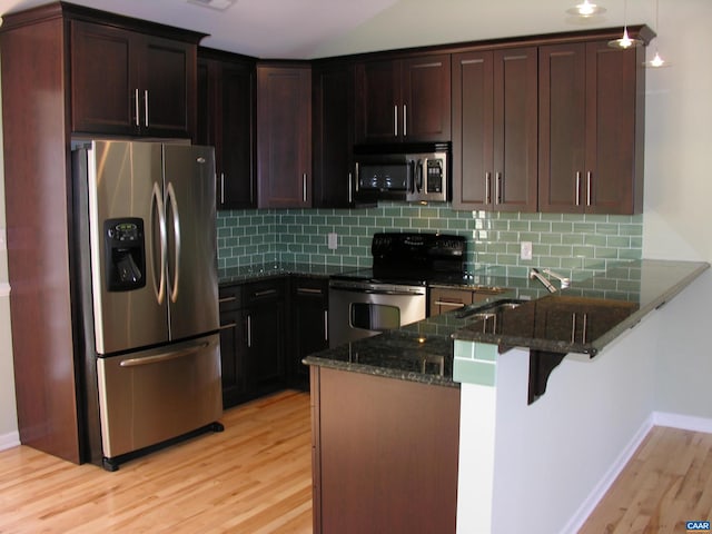 101 Sterling Dr, Waynesboro, VA 22980 - kitchen with appliances with stainless steel finishes, a sink, dark stone countertops, and light wood-type flooring