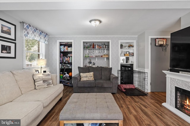 10317 Beaumont St, Fairfax, VA 22030 - living room featuring a fireplace, dark wood-style floors, built in shelves, and crown molding