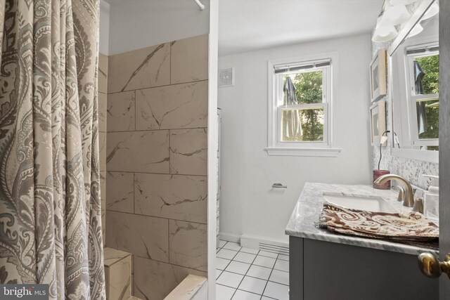 10317 Beaumont St, Fairfax, VA 22030 - bathroom with vanity, healthy amount of natural light, tile patterned floors, and curtained shower