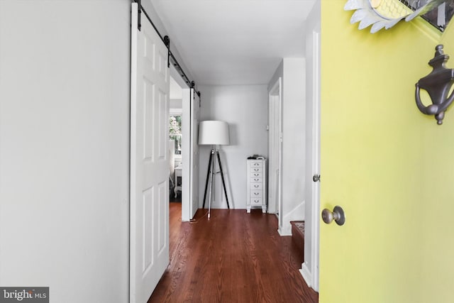 10317 Beaumont St, Fairfax, VA 22030 - corridor featuring a barn door and dark wood-style flooring