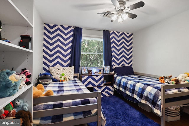 10317 Beaumont St, Fairfax, VA 22030 - bedroom with wallpapered walls, an accent wall, carpet flooring, and a ceiling fan
