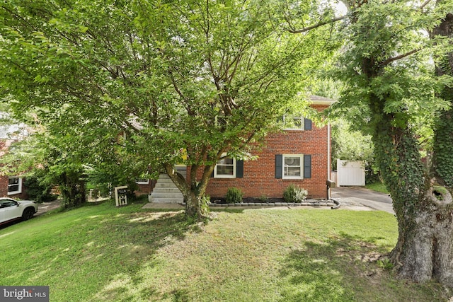 10317 Beaumont St, Fairfax, VA 22030 - obstructed view of property with a front lawn and brick siding