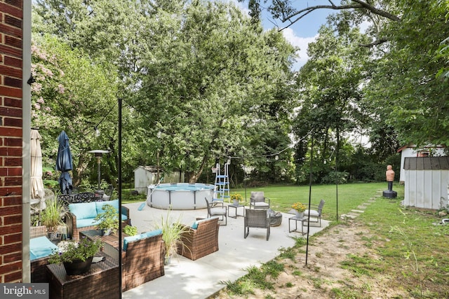 10317 Beaumont St, Fairfax, VA 22030 - view of grassy yard featuring outdoor lounge area, a patio area, and an outdoor pool