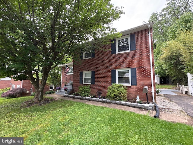 10317 Beaumont St, Fairfax, VA 22030 - view of front of property featuring a front yard and brick siding