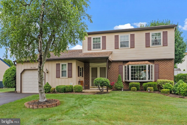 3604 Haystack Ln, Bensalem, PA 19020 - view of front of house with an attached garage, a front yard, asphalt driveway, and brick siding