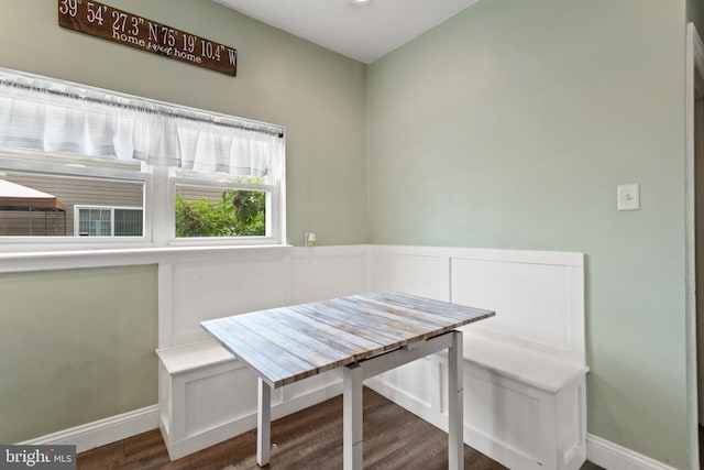 dining area featuring breakfast area, wood finished floors, and baseboards