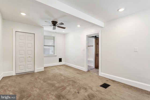 unfurnished bedroom featuring carpet, baseboards, recessed lighting, a closet, and ensuite bathroom