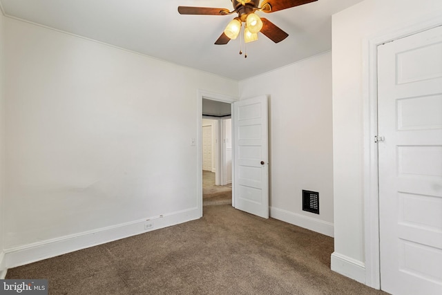unfurnished bedroom with carpet floors, baseboards, and a ceiling fan