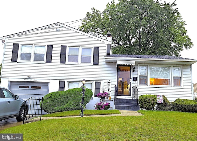 1417 Oriental Ave, Gloucester City, NJ 08030 - tri-level home featuring a garage, a front yard, and a chimney