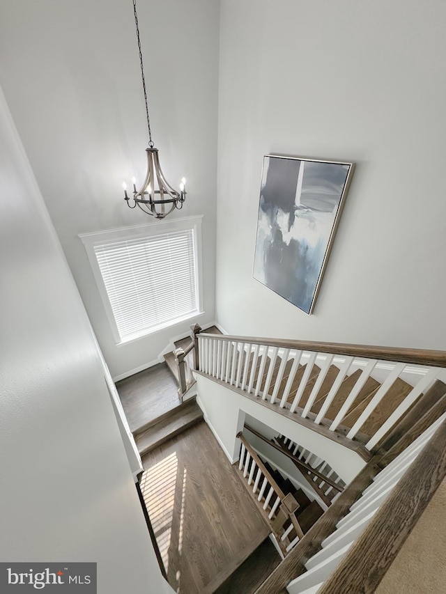 18030 Stump St, Dumfries, VA 22026 - stairway featuring a chandelier and wood finished floors