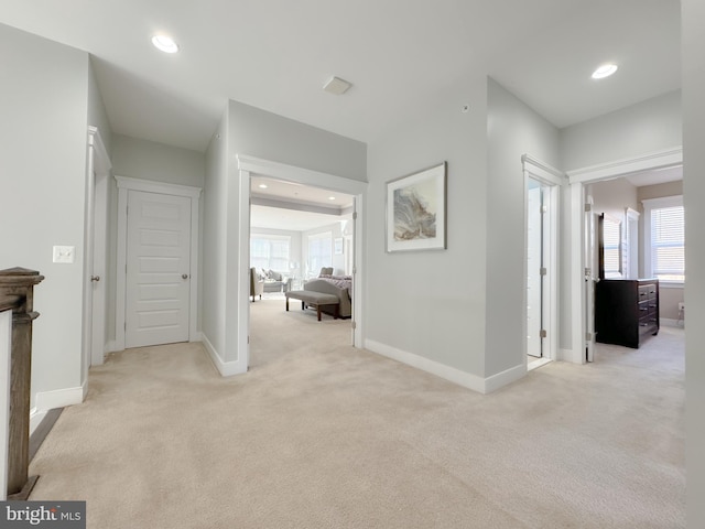 18030 Stump St, Dumfries, VA 22026 - hall with light colored carpet, baseboards, plenty of natural light, and recessed lighting