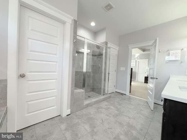 18030 Stump St, Dumfries, VA 22026 - full bath featuring vanity, a shower stall, baseboards, and recessed lighting