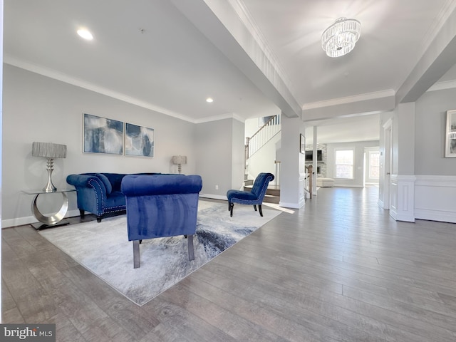 18030 Stump St, Dumfries, VA 22026 - living area featuring wood finished floors, stairs, crown molding, recessed lighting, and a chandelier