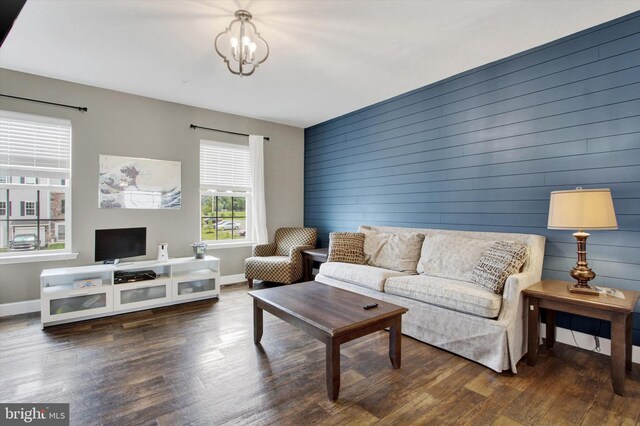 31 Holstein Dr, Hanover, PA 17331 - living room with wood finished floors, a chandelier, baseboards, and wood walls