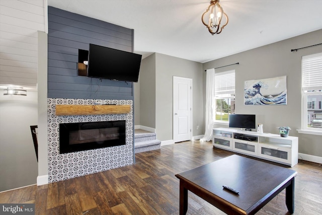 31 Holstein Dr, Hanover, PA 17331 - living area with wood finished floors, a tiled fireplace, baseboards, and stairway