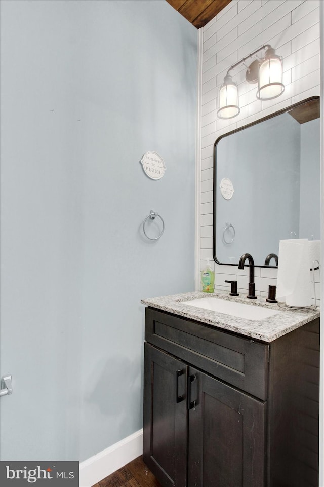 31 Holstein Dr, Hanover, PA 17331 - bathroom featuring vanity, wood finished floors, and baseboards