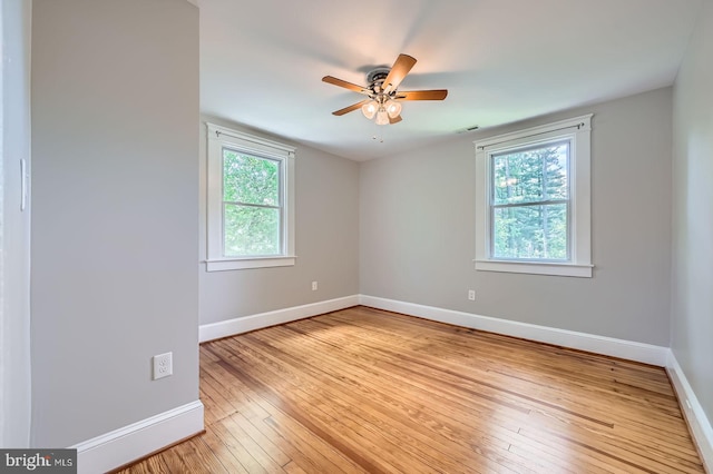 818 Glen Allen Dr, Baltimore, MD 21229 - empty room featuring baseboards, healthy amount of natural light, and light wood-type flooring