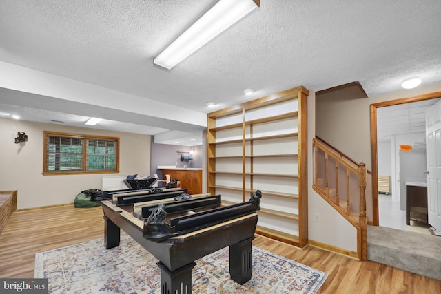 3 Franklin St, Stafford, VA 22556 - sitting room with a textured ceiling, wood finished floors, stairway, and baseboards