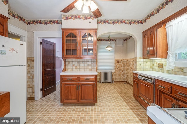27 N Warren St, Woodbury, NJ 08096 - kitchen with freestanding refrigerator, radiator heating unit, ceiling fan, and light countertops