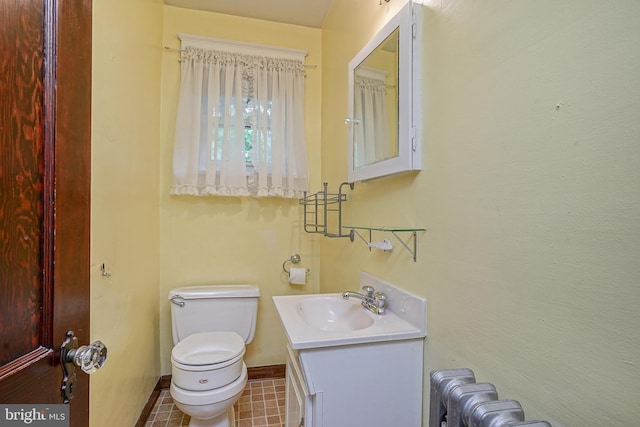 27 N Warren St, Woodbury, NJ 08096 - bathroom featuring toilet, vanity, baseboards, and tile patterned floors