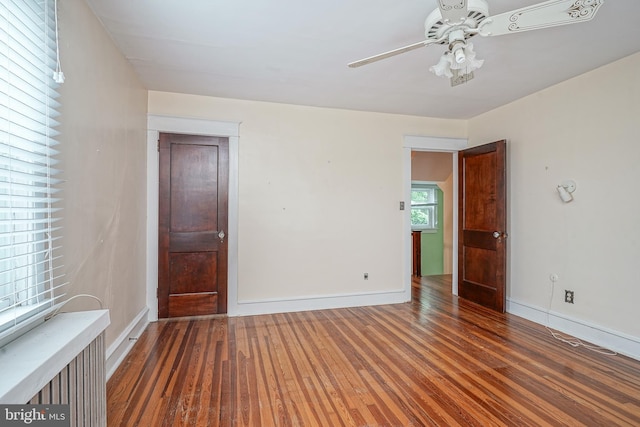27 N Warren St, Woodbury, NJ 08096 - spare room with hardwood / wood-style floors, a ceiling fan, and baseboards