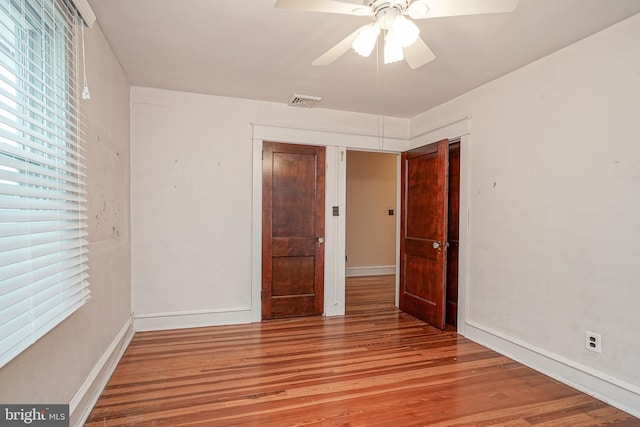 27 N Warren St, Woodbury, NJ 08096 - empty room with wood finished floors, a ceiling fan, and baseboards