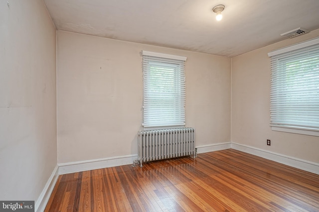 27 N Warren St, Woodbury, NJ 08096 - unfurnished room with radiator heating unit, hardwood / wood-style floors, and baseboards