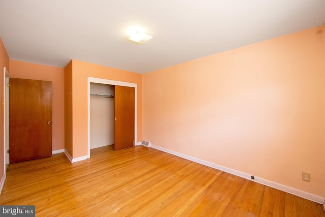 4021 Balwynne Park Rd, Philadelphia, PA 19131 - unfurnished bedroom with a closet, light wood-type flooring, and baseboards