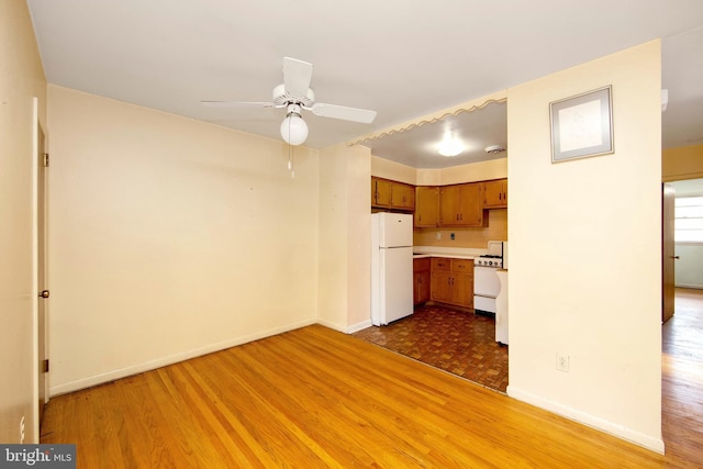 4021 Balwynne Park Rd, Philadelphia, PA 19131 - unfurnished living room featuring wood finished floors, ceiling fan, and baseboards