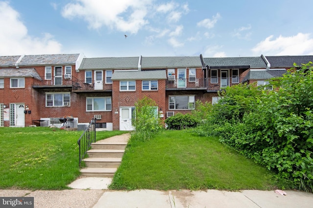 4021 Balwynne Park Rd, Philadelphia, PA 19131 - view of front of home with brick siding and a front lawn