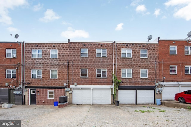 4021 Balwynne Park Rd, Philadelphia, PA 19131 - view of building exterior featuring an attached garage, central air condition unit, and driveway