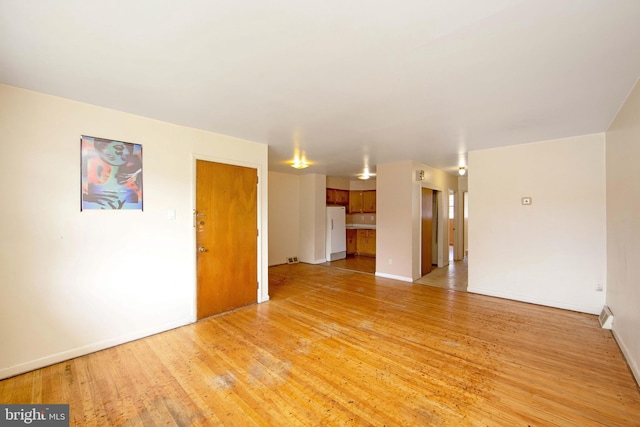 4021 Balwynne Park Rd, Philadelphia, PA 19131 - unfurnished living room with light wood-style floors and baseboards